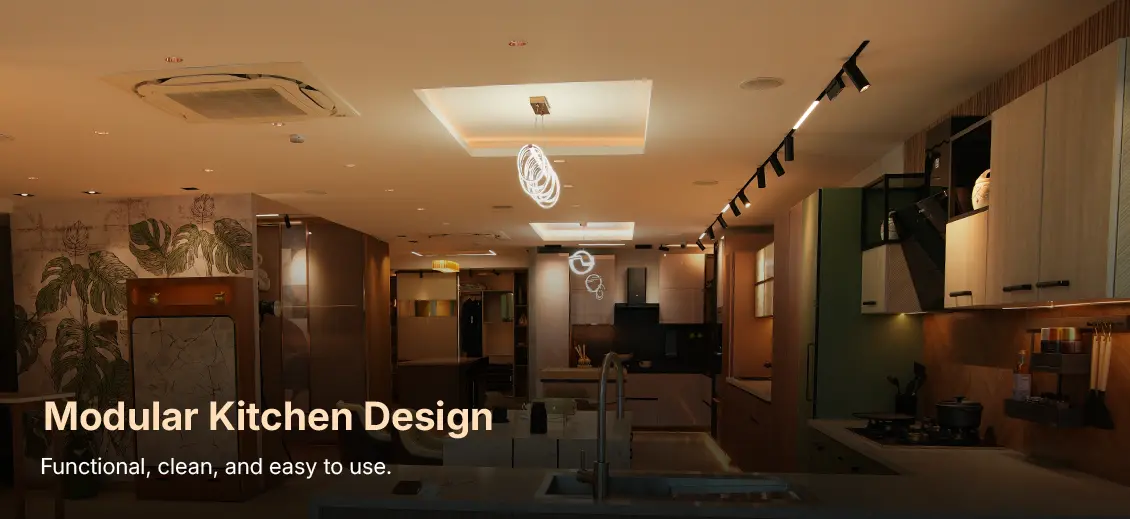 Modern kitchen showroom with an island sink, white and wood cabinetry, and track lighting; overlay reads 'Modular Kitchen Design' and 'Functional, clean, and easy to use.'