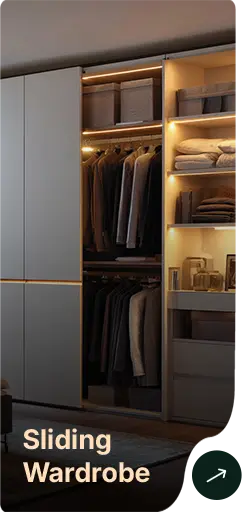 Open sliding wardrobe: hanging clothes on the left and shelves with folded items on the right, illuminated by warm built-in lighting.